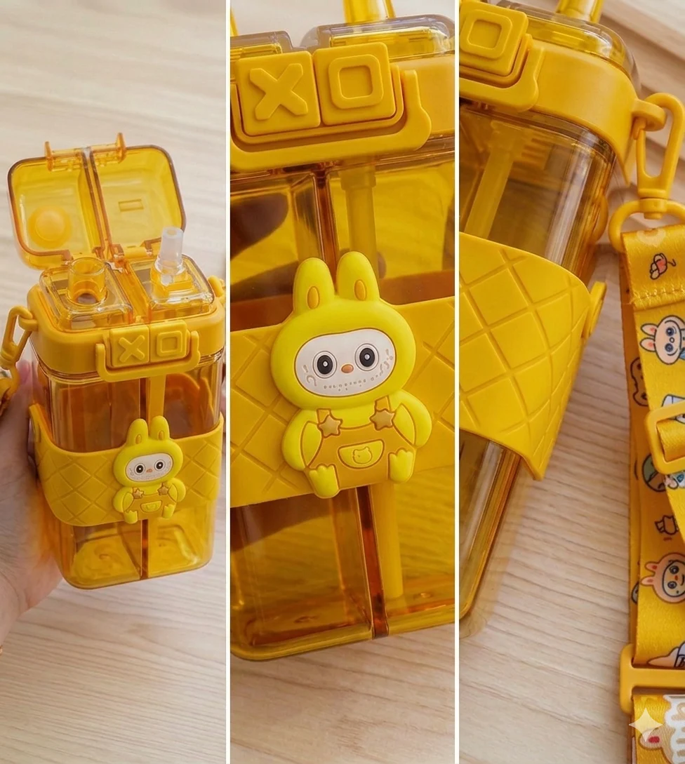 “Yellow bunny-themed dual-chamber water bottle for children, with cute cartoon design, secure white latch, and colorful strap, perfect for hydration at school or playtime.”