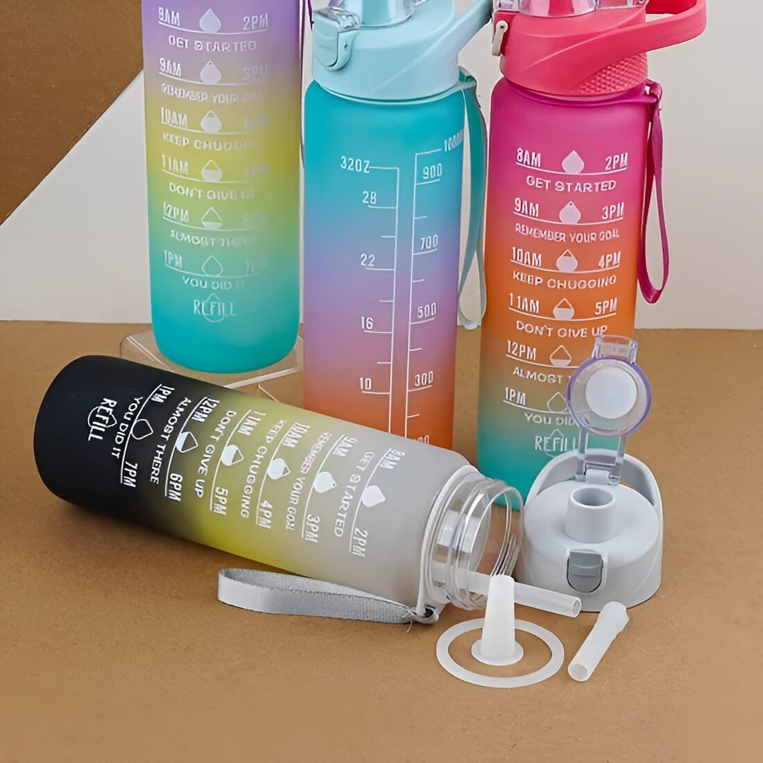 “Multiple Shadow Motivational Water Bottles front view showing four color variants – red gradient, green, purple, and grey bottles arranged side by side with motivational design and time markers”