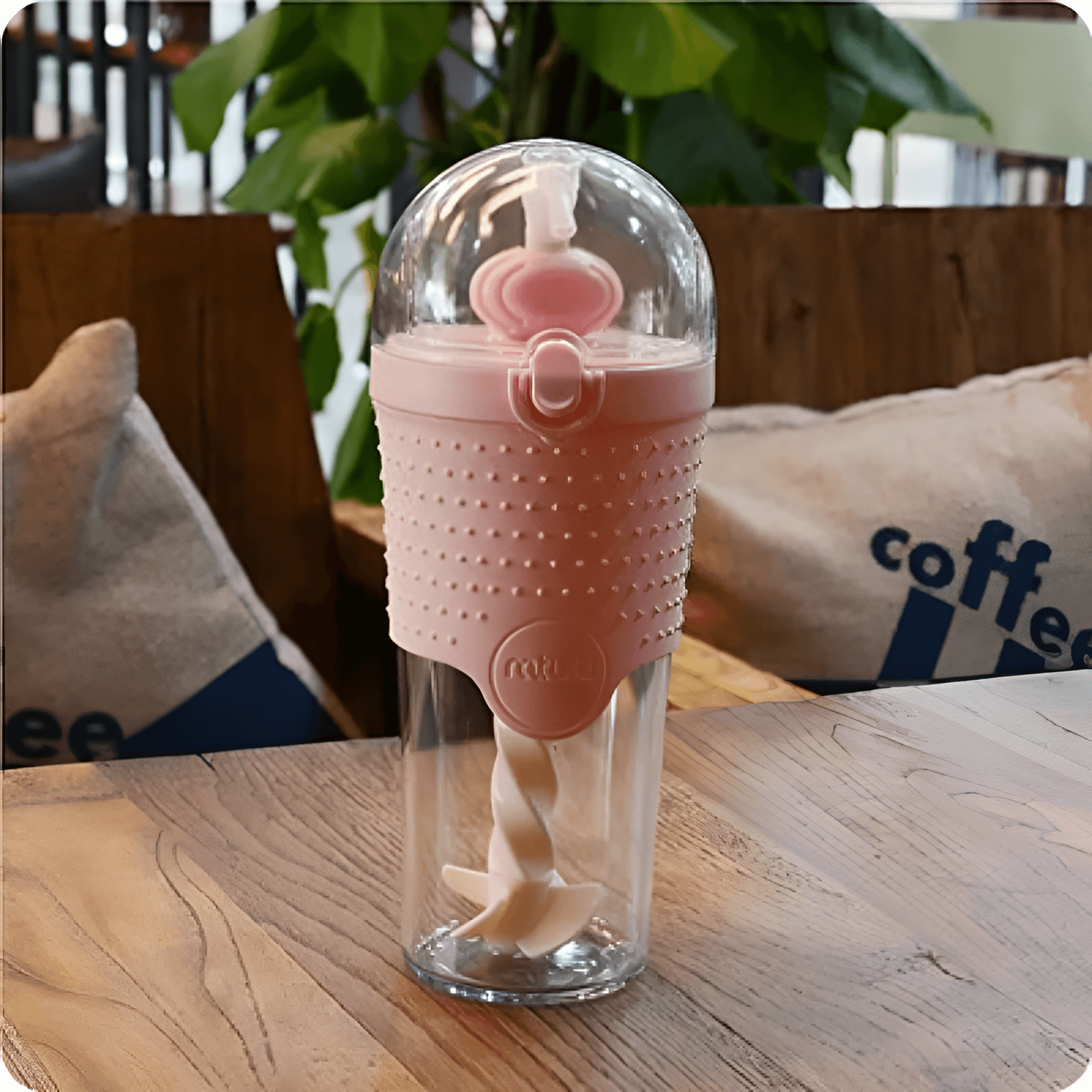Colorful plastic  pink water bottles with a knitted cover in various colors.